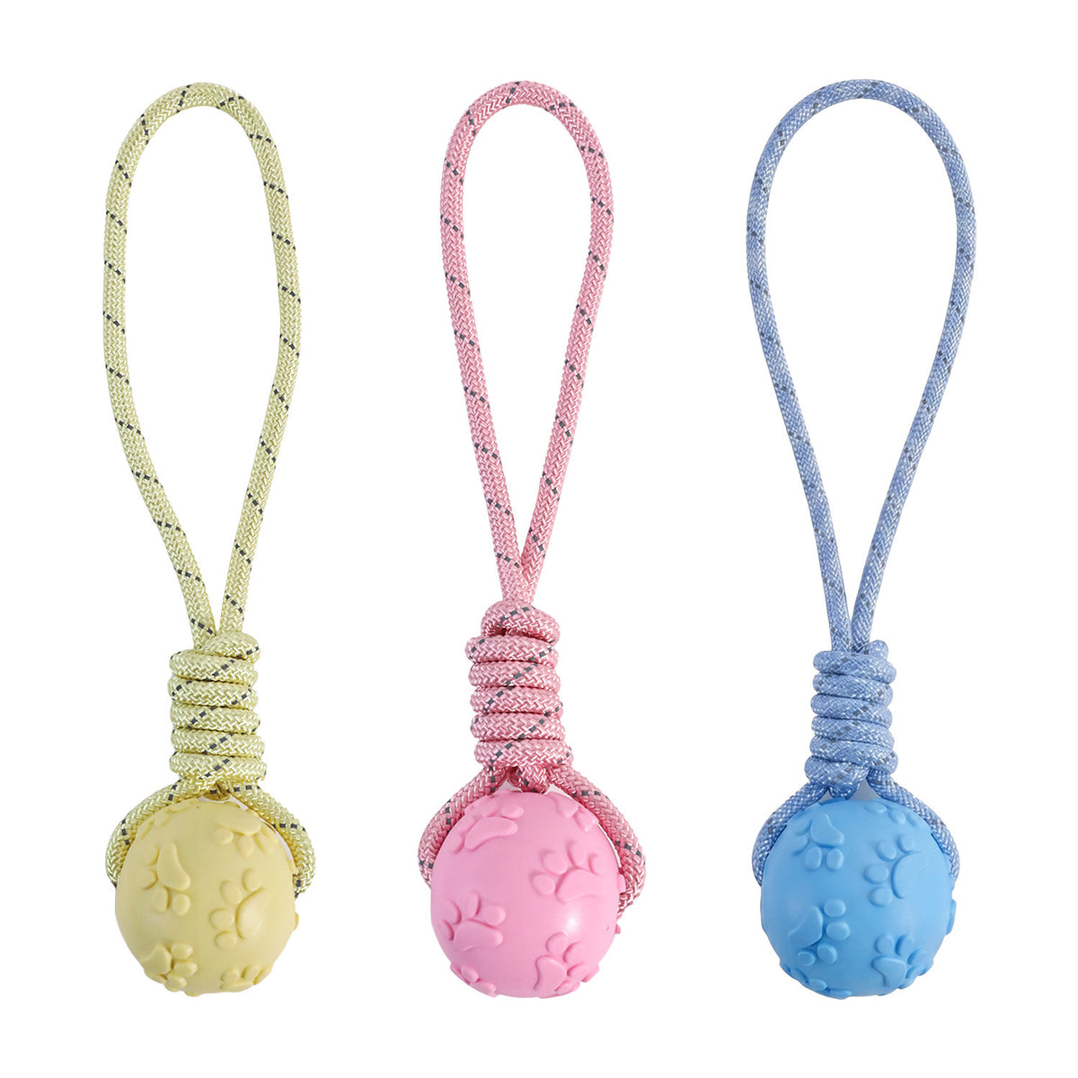All three colourways of the rubber ball on rope side by side: butter yellow, pink and blue