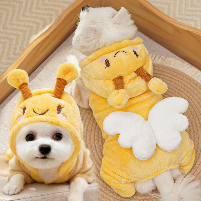 Two dogs wearing the yellow hooded bee suit, showing the antennae and wings