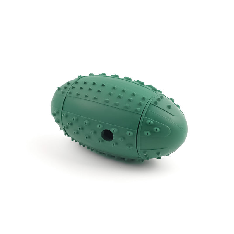 Forest green rubber rugby ball dog toy with a nubbed surface and a kibble hole at one end