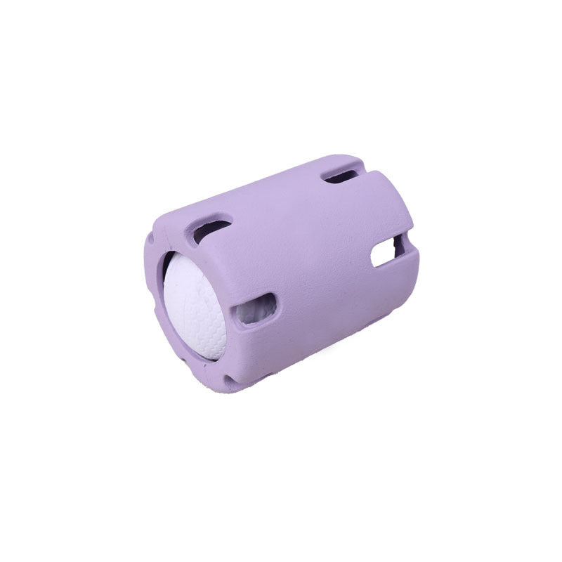 Lilac slotted rubber dog ball cage holding a white textured ball