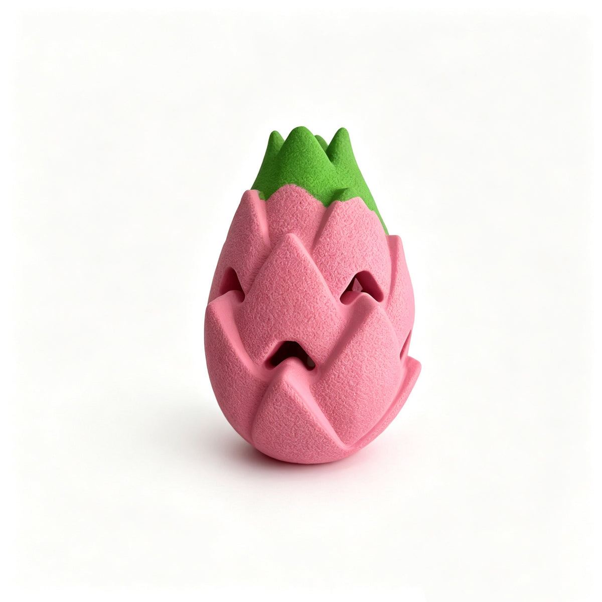 Pink rubber dragon fruit dog treat toy with green tips and a faceted body