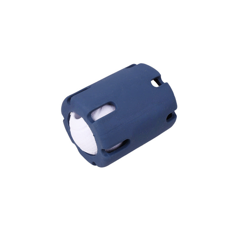 Navy slotted rubber dog ball cage holding a white textured ball