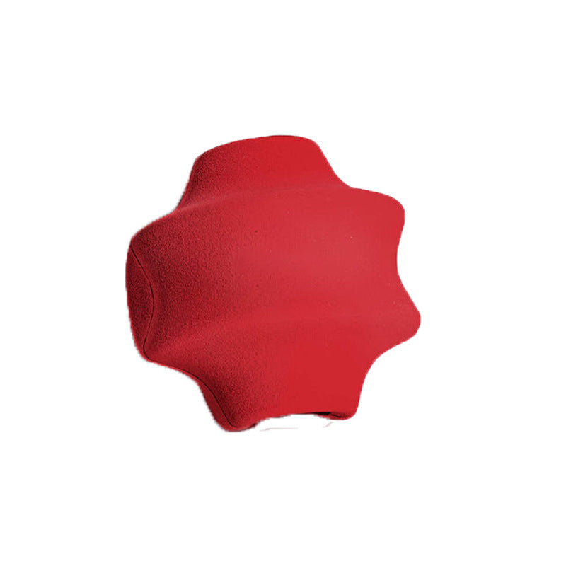 Red natural rubber dog treat ball with ridged star profile and treat opening
