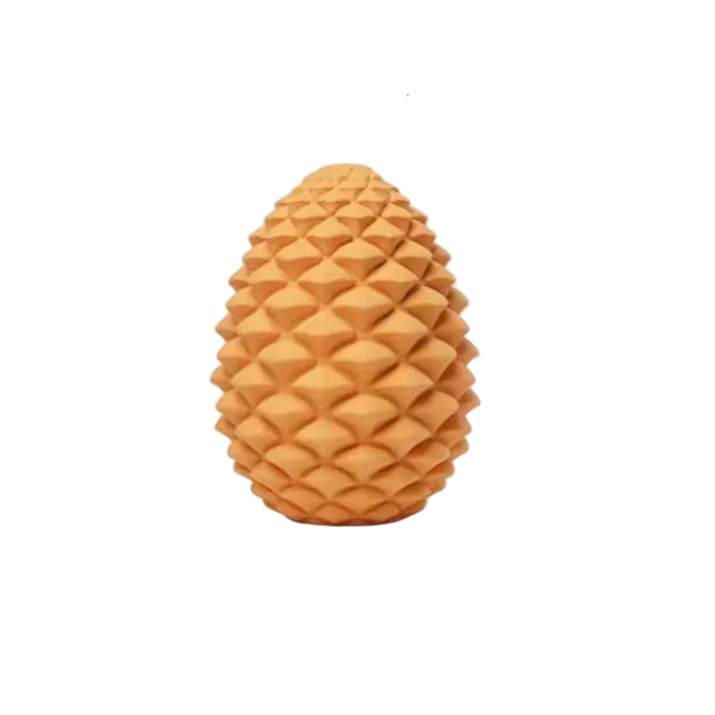 Yellow rubber pine cone dog treat toy, same layered scale moulding as the brown