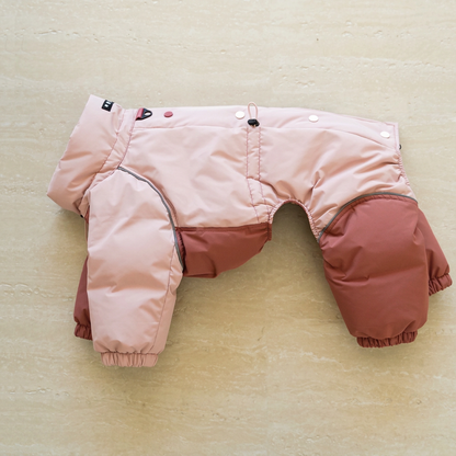 Pink Autumn Breeze dog outdoor suit with rust-red panels laid flat, showing snap buttons, adjustment cord, elasticated cuffs and sewn collar label.