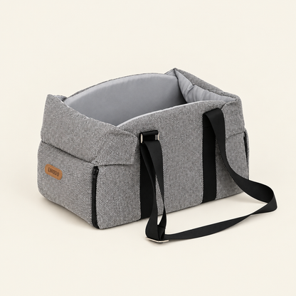 Grey pet carrier bed on an off-white background