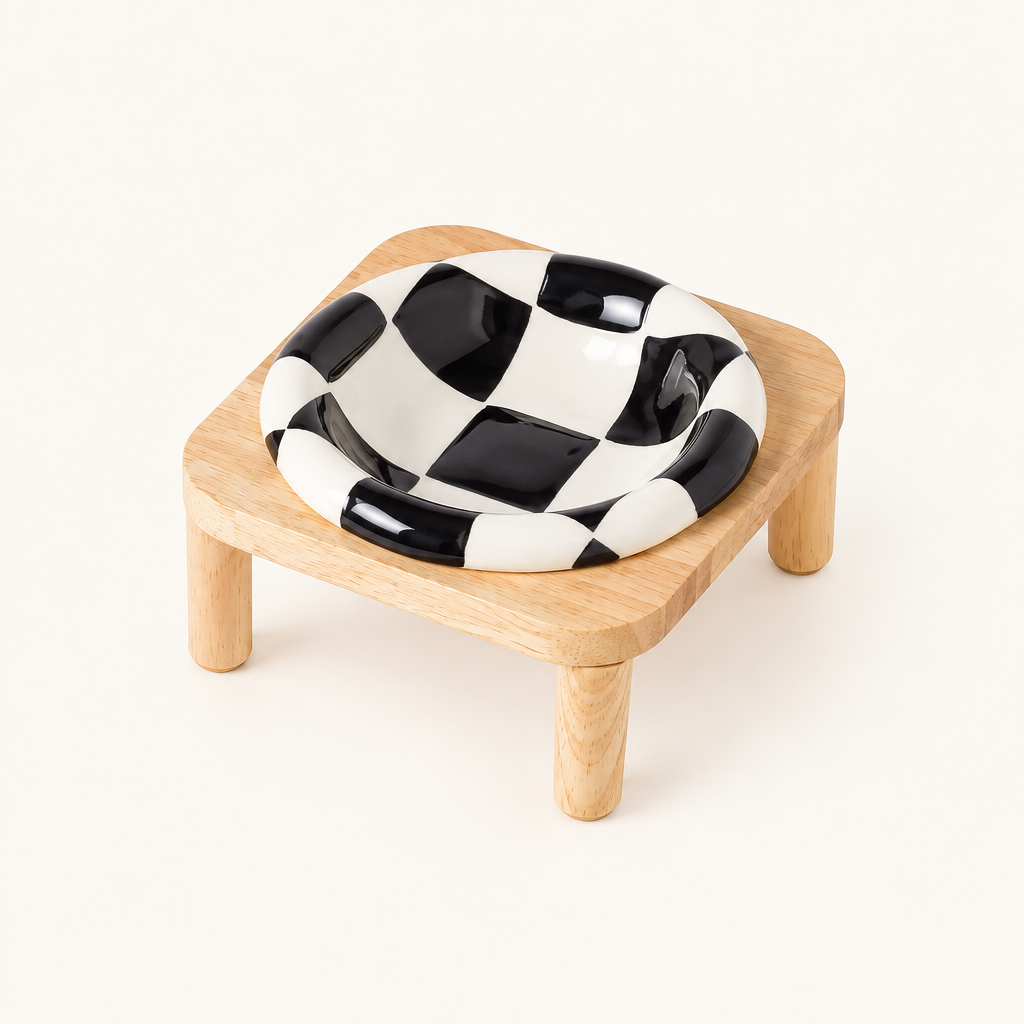 Black checkerboard bowl on tall stand