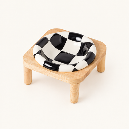 Black checkerboard bowl on tall stand