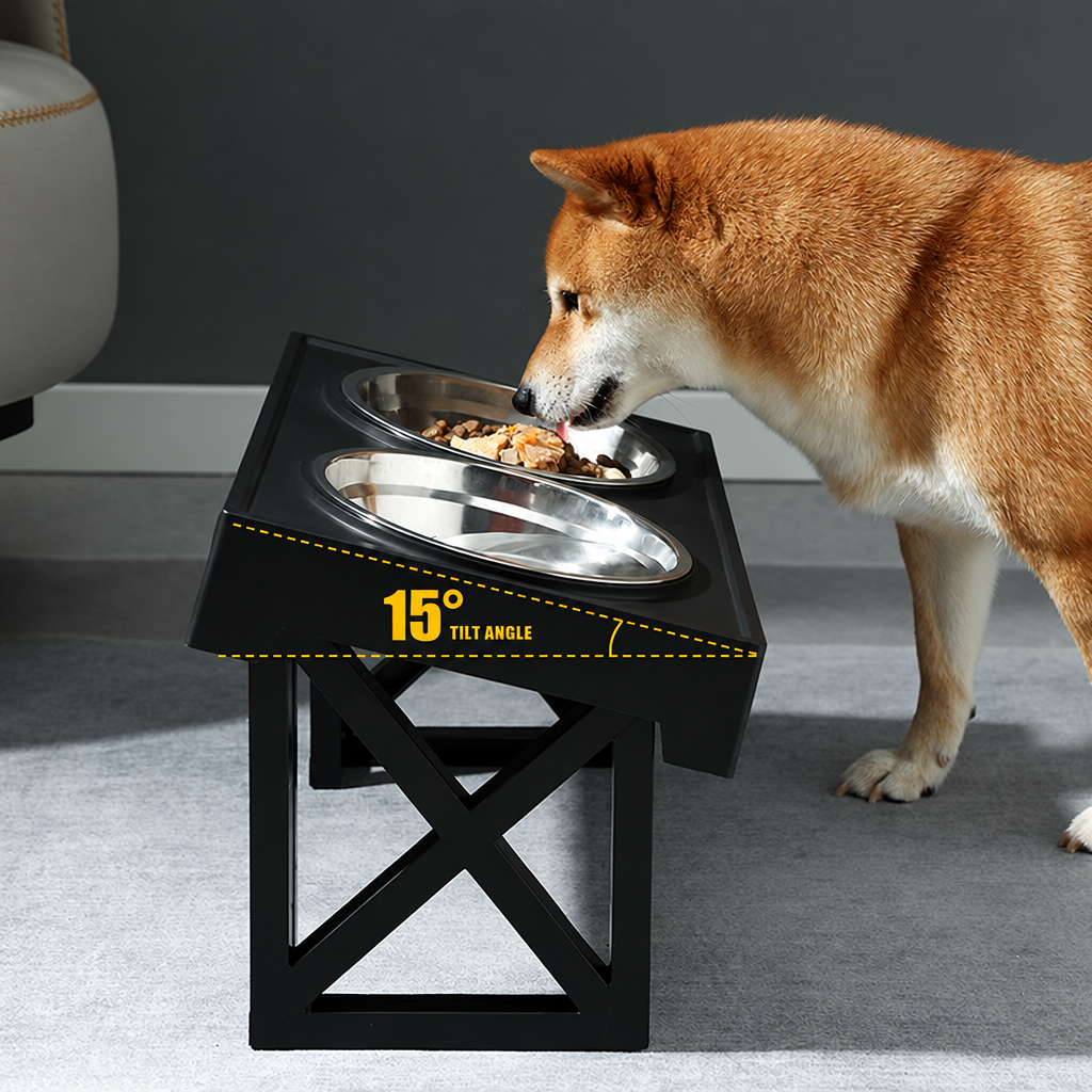 Dog eating from tilted black feeder with 15 degree angle label