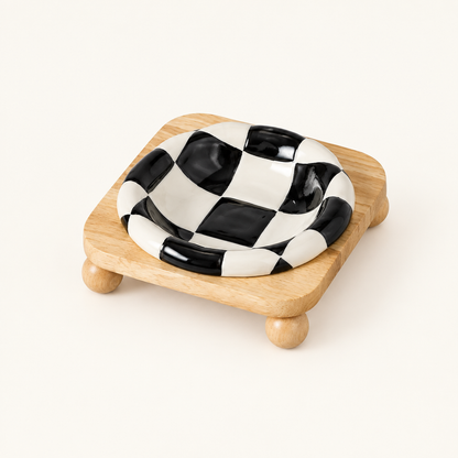 Black checkerboard bowl on low stand