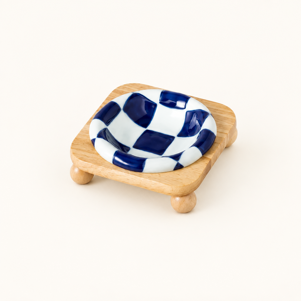 Blue checkerboard bowl on low stand
