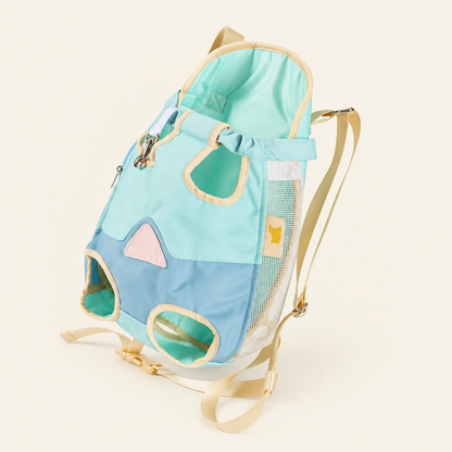 Mint and blue legs-out pet carrier on a blanc cassé background