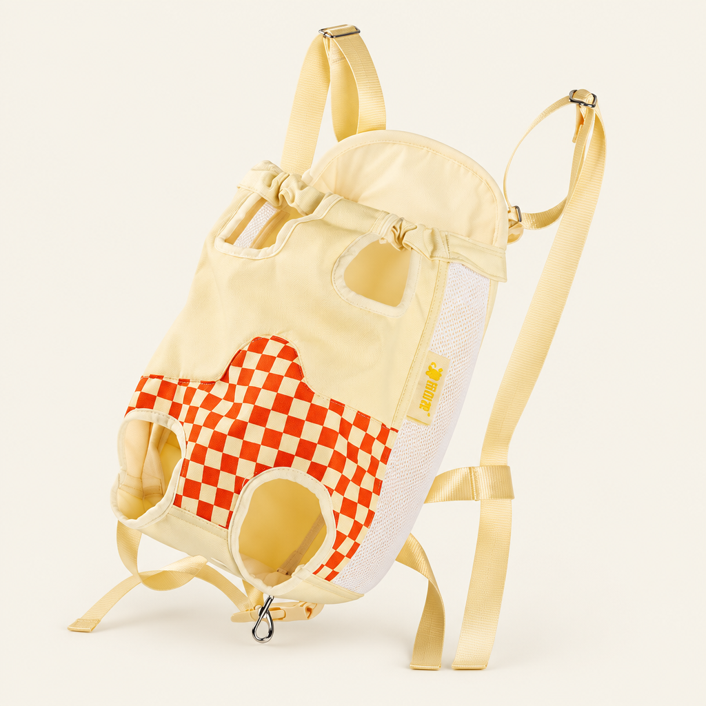 Cream and orange-red checked pet carrier on a blanc cassé background