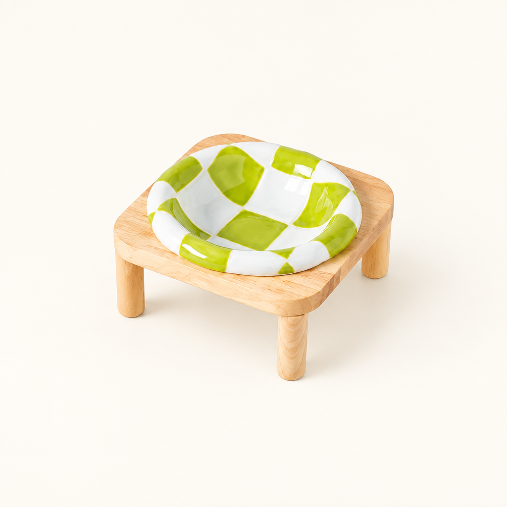 Green checkerboard bowl on tall stand