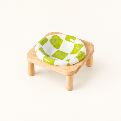 Green checkerboard bowl on tall stand