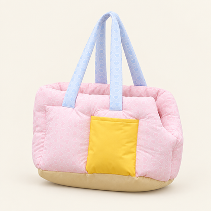 Pink pet bed carrier on an off-white background