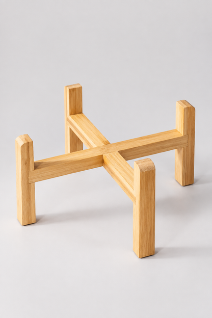Wooden bowl stand on the light-grey studio background